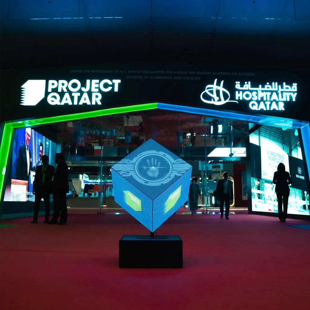 LED cube for rent Vegas — 7ft rotating LED video cube at a trade show exhibition entrance