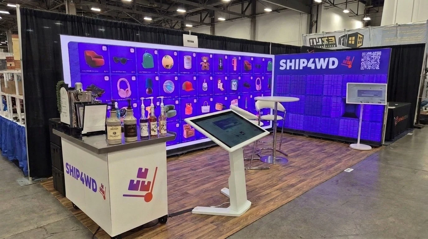 Trade show booth featuring a wide LED display wall